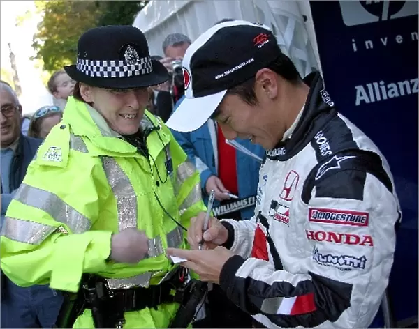 Mount Stuart Classic: BAR Honda test driver Takuma Sato, right, is given a speeding ticket by a policewoman