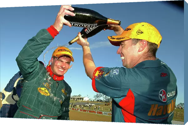2002 Australian V8 Supercar Championship R9 QLD 500 Queensland, Australia.15th September 2002 Ford driver David Besnard and C0 driver Simon Wills on the podium after winning the QLD 500