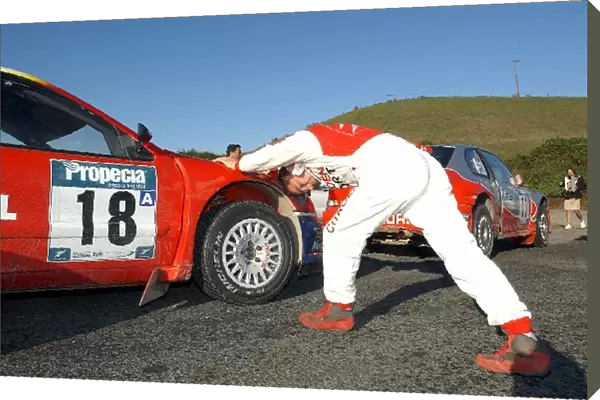 FIA World Rally Championship: Sebastien Loeb gets some stretching exercises completed before the days opening stage in his Citroen Xsara WRC