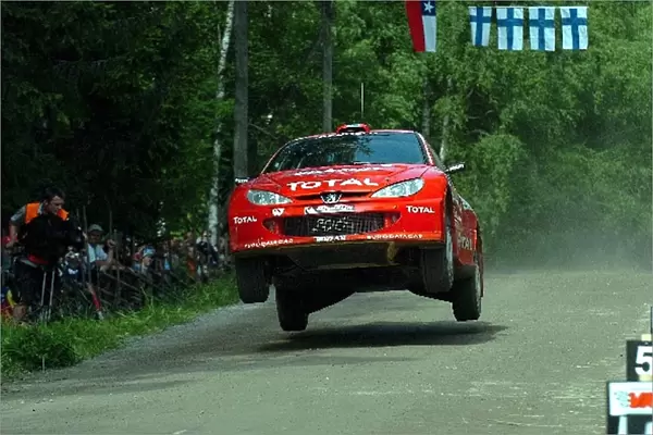 FIA World Rally Championship: Daniel Carlsson, Peugeot 206 WRC, on stage 14