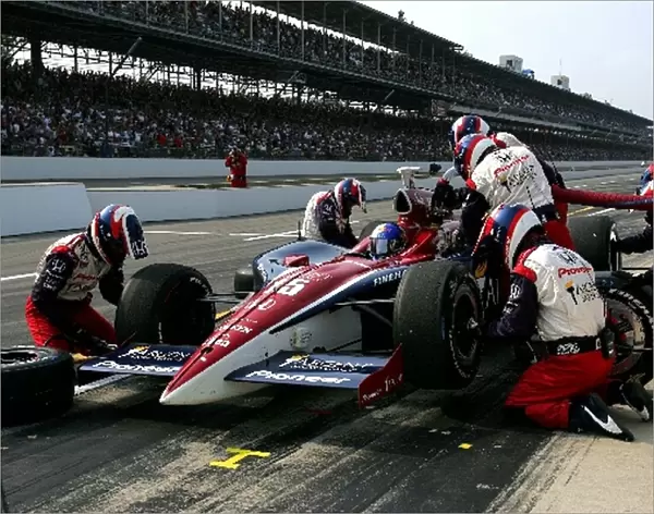 Indy Racing League: Buddy Rice makes a pit stop during the Indianapolis 500, Indianapolis Motor Speedway, Indianapolis, IN, 30, May, 2004. 04irl04a