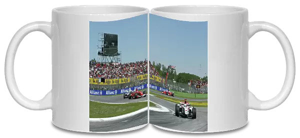 2004 San Marino Grand Prix-Sunday Race, Imola, Italy. 25th April 2004. Jenson Button, BAR Honda 006, leads Michael Schumcaher, Ferrari F2004, action. World Copyright LAT Photographic. ref: Digital Image Only