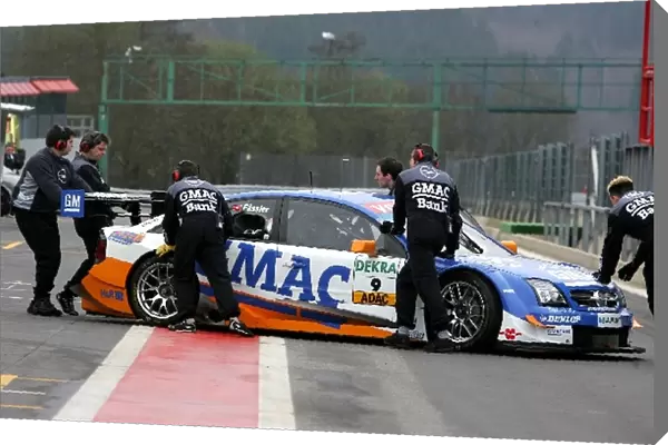 DTM Pre-Season Testing: Opel mechanics push the car of Marcel Fassler, Opel Performance Center, Opel Vectra GTS V8, back into the pits