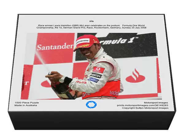 n / a. Race winner Lewis Hamilton (GBR) McLaren celebrates on the podium.