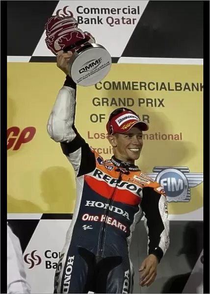 MotoGP. Race winner Casey Stoner (AUS) Repsol Honda, celebrates on the podium.