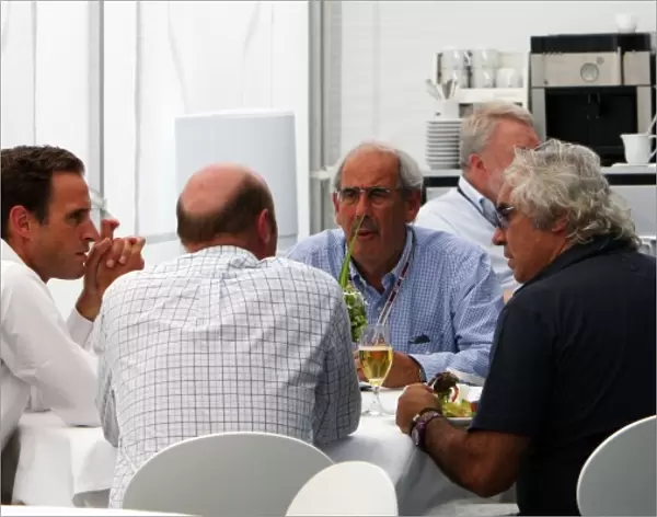 Formula One World Championship: Flavio Briatore talks with Nicholas Clarry, CVC Capital Partners and Donald McKenzie CVC Capital Partners