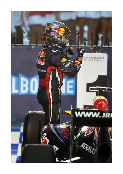 Formula One World Championship: Race winner Sebastian Vettel Red Bull Racing RB7 celebrates in parc ferme
