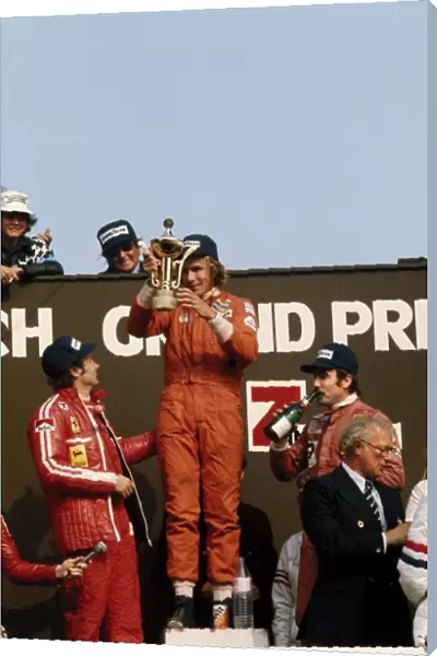 1975 Dutch Grand Prix - Podium: James Hunt, 1st position, with Niki Lauda, 2nd position and Clay Regazzoni, 3rd position on the podium, portrait