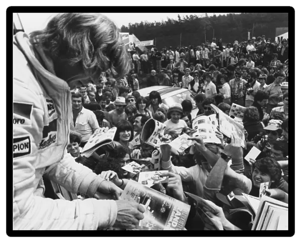 1979 Belgian Grand Prix: James Hunt, retired, signs autographs for fans, atmosphere, portrait