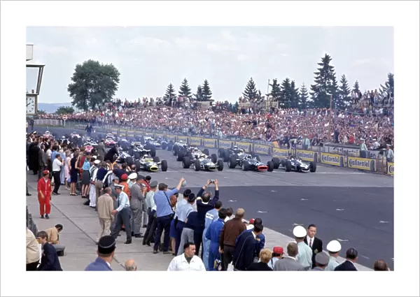 Nurburgring, Germany. 4-6 August 1967: Jim Clark, Denny Hulme, Jackie Stewart and Dan Gurney on the front row of the grid at the start