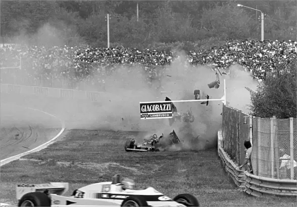 Imola, Italy. 12-14 September 1980: Jean-Pierre Jabouille passes as Gilles Villeneuve crashes out of the race. Accident