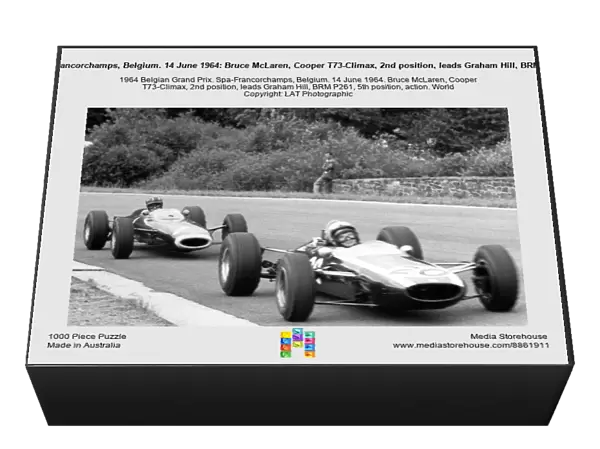 Spa-Francorchamps, Belgium. 14 June 1964: Bruce McLaren, Cooper T73-Climax, 2nd position, leads Graham Hill, BRM P261, 5th position, action