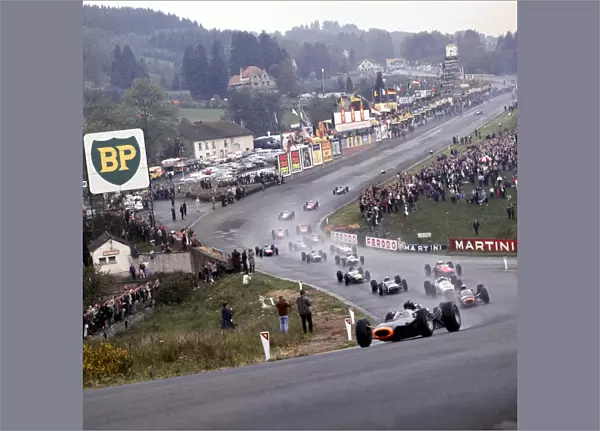 1965 Belgian Grand Prix: Graham Hill leads Jackie Stewart, Richie Ginther, Jo Siffert, John Surtees, Dan Gurney and the rest of the field through