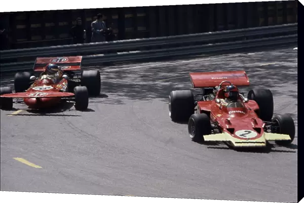 1971 Spanish Grand Prix: Ronnie Peterson, retired, is passed by Emerson Fittipaldi, retired, action