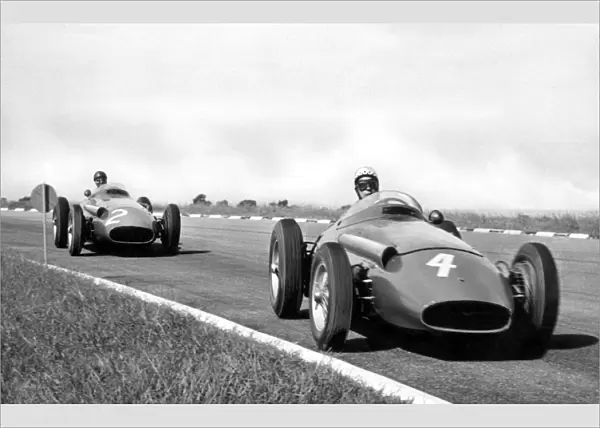 Buenos Aires, Argentina. 19th January 1958: Jean Behra, leads Juan Manuel Fangio, action