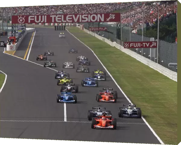 2001 Japanese Grand Prix - Sunday  /  Race: Race winner Michael Schumacher, Ferrari F2001, leads at the start of the race