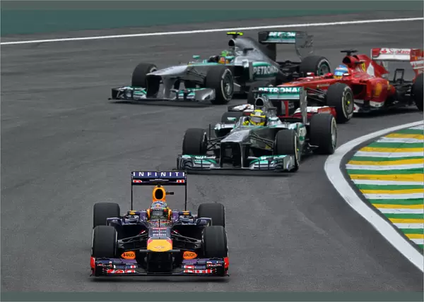 Formula One World Championship: Sebastian Vettel Red Bull Racing RB9 leads Nico Rosberg Mercedes AMG F1 W04; Fernando Alonso Ferrari F138