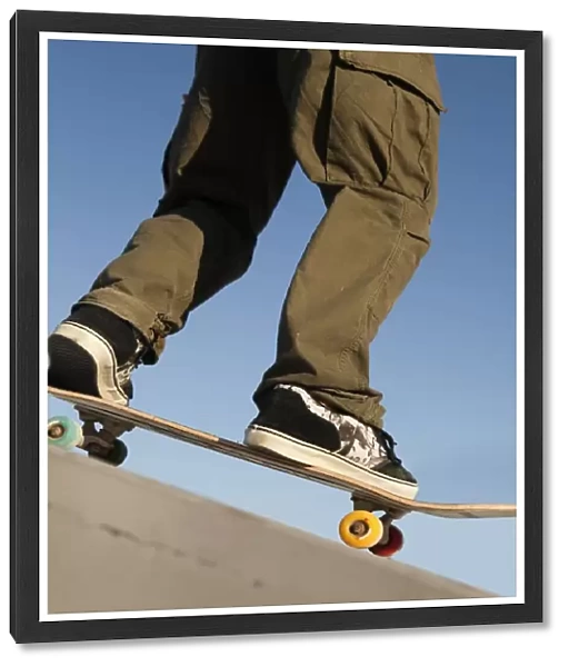 Low Angle View Of Young Male Skateboarder