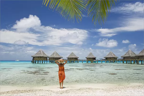 French Polynesia, Tuamotu Islands, Rangiroa Atoll, Woman On Beach Near Luxury Resort