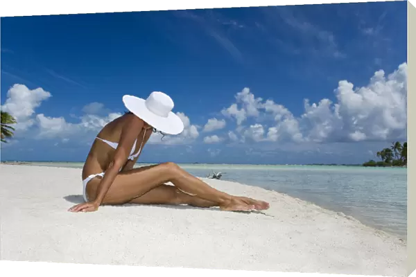 French Polynesia, Tuamotu Islands, Rangiroa Atoll, Woman Sitting On White Sand Beach