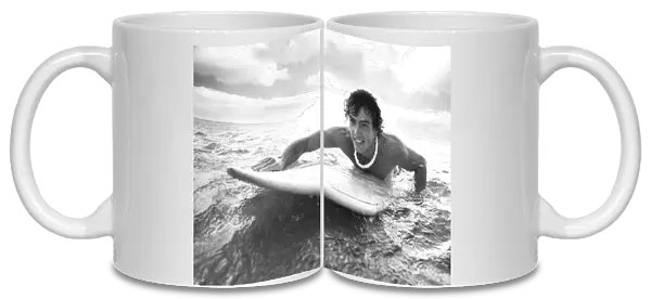 Hawaii, Oahu, Young Man Paddling On His Surfboard In The Water
