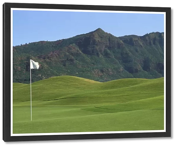 Hawaii, Kauai, Kauai Marriott Golf Course Rolling Hills With Mountains In Background, White Flag