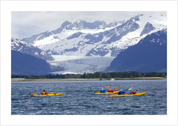 Sea Kayakers In Gastineau Channel With Mendenhall Glacier And Coast Mountains In The Background In Southeast Alaska During Summer
