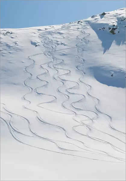 Ski tracks in the snow on a mountain; Zermatt valais switzerland