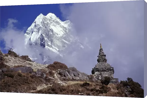 Snow Covered Peak With Cultural Monument In Forefront