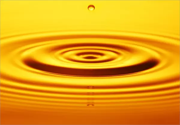 Split Second Drop Of Gold Liquid