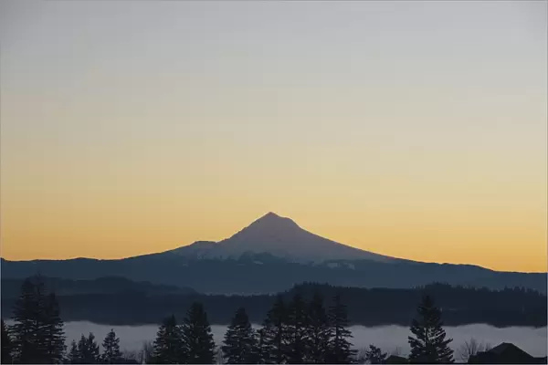 Silhouette Of Mountain Peak At Sunrise
