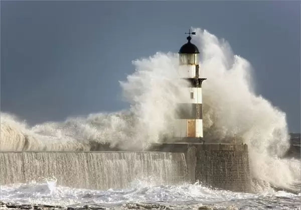 Seaham, Teesside, England; Waves Crashing Into A Lighthouse