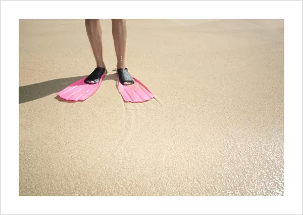 Hawaii, Woman Wearing Pink Snorkel Flippers On Sandy Beach