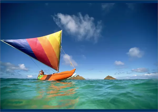 Hawaii, Oahu, Lanikai, Man In Colorful Sailing Canoe