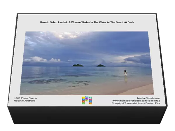 Hawaii, Oahu, Lanikai, A Woman Wades In The Water At The Beach At Dusk