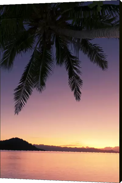 Fiji, Matangi Private Island Resort, Sunset glow over ocean