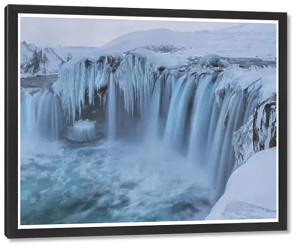 Godafoss With Large Pieces Of Ice Forming In The Cold Weather; Iceland