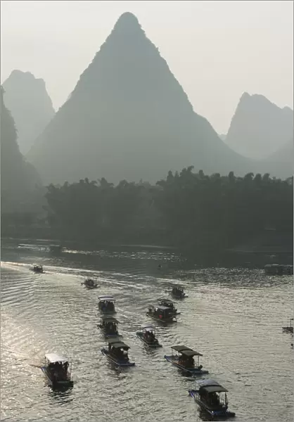 Boats Along The Li River At Sunset; Guilin, Guangxi, China