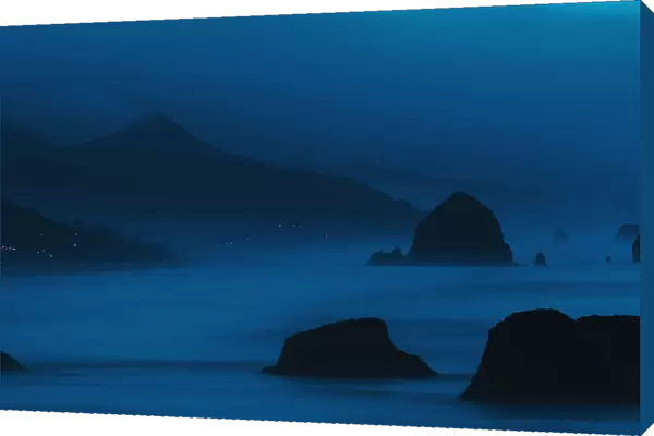 Dawn Reveals The Coastline; Cannon Beach, Oregon, United States Of America