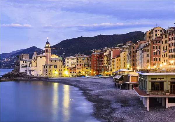 Buildings Illuminated By Lights Along The Waters Edge At Sunrise; Camogli, Liguria, Italy