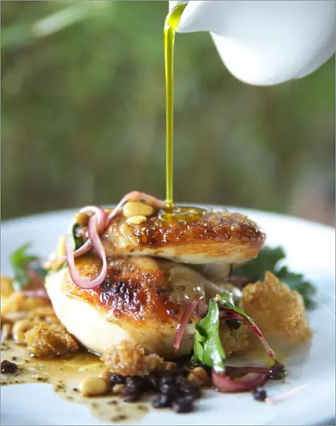 Hawaii, Olive Oil Being Poured Over Delicious Chicken Dish