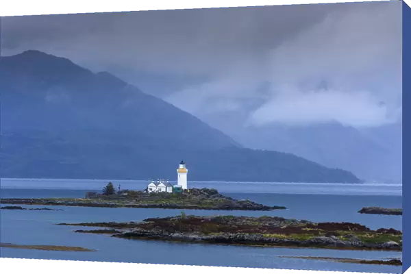Ornsay Lighthouse with low haning clouds on the Isle of Skye in Scotland, United Kingdom