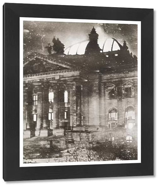 The Reichstag fire, an arson attack on the Reichstag building, Berlin on 27 February 1933. From These Tremendous Years, published 1938