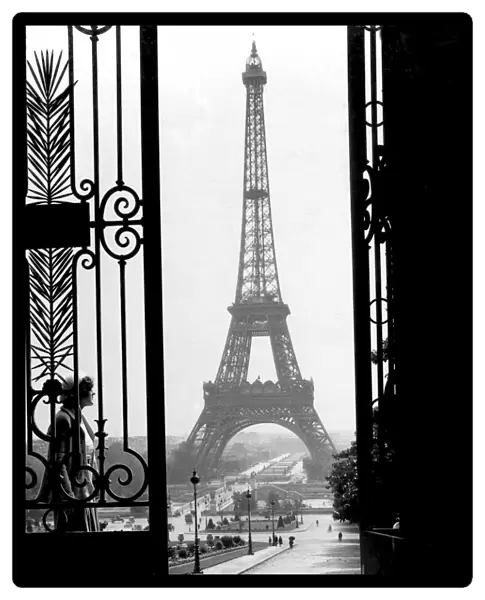 Historic image in black and white of the Eiffel Tower in Paris, France circa 1920; Paris, France