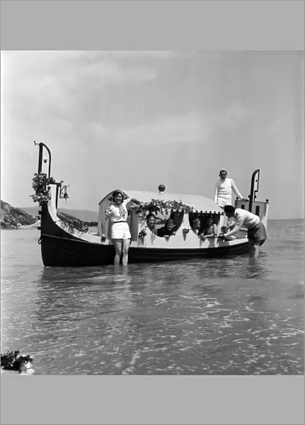 Holiday: Transport: Boats. A gondolier on the beach in Cornwall. June 1953 D3025-001