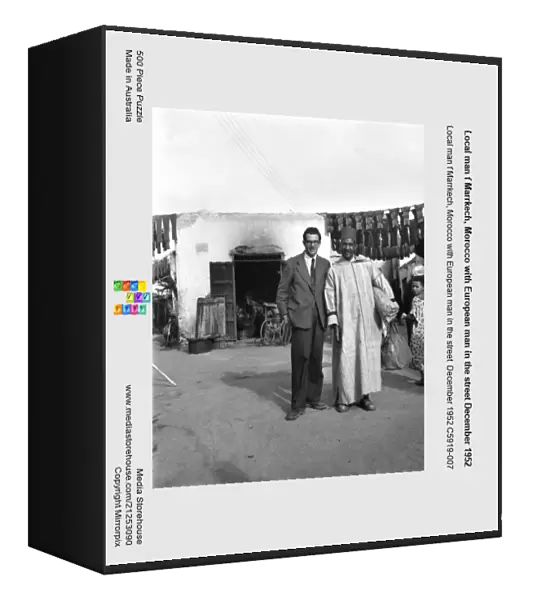 Local man f Marrkech, Morocco with European man in the street December 1952
