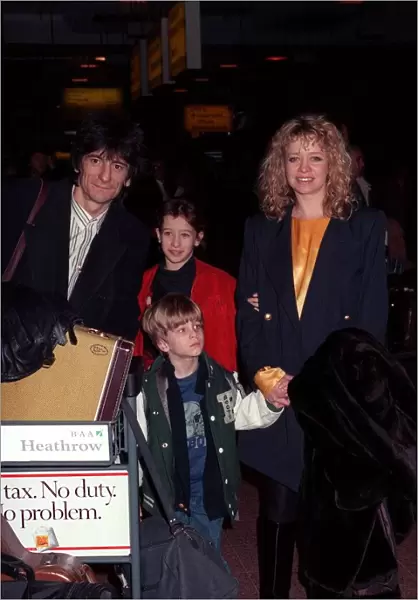 Ronnie Wood and family arriving at Heathrow airport in February 1990
