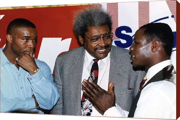 Don King Boxing promoter talks with Chris Eubank on his right