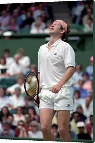 Wimbledon Tennis. Stefan Edberg beats John McEnroe who looks unhappy