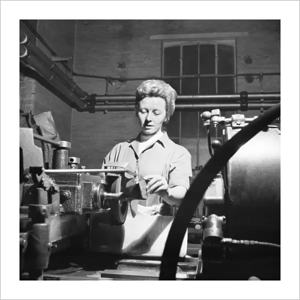 Invention Increases Production - Leyland Motors Ltd Mrs Joan McManmon shows the devices